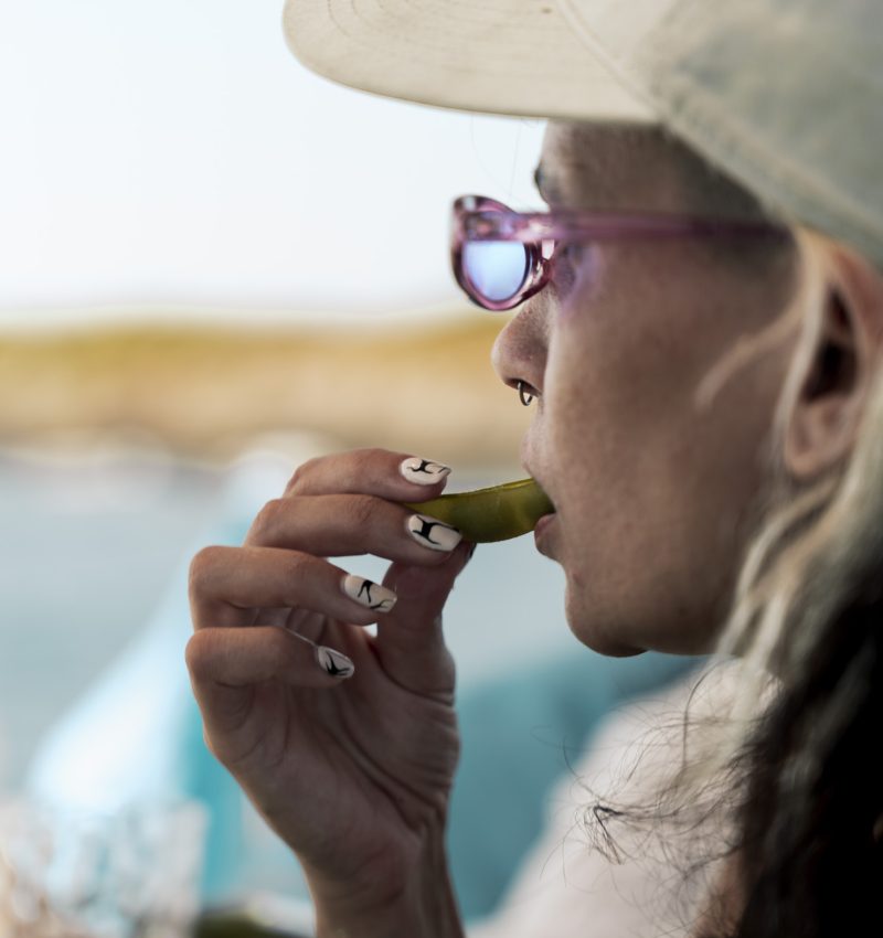 Guest tasting seafood during a private boat tour Mallorca