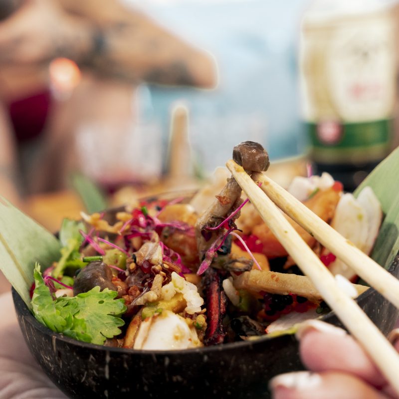 Asian-inspired gourmet dish served during a sailing experience