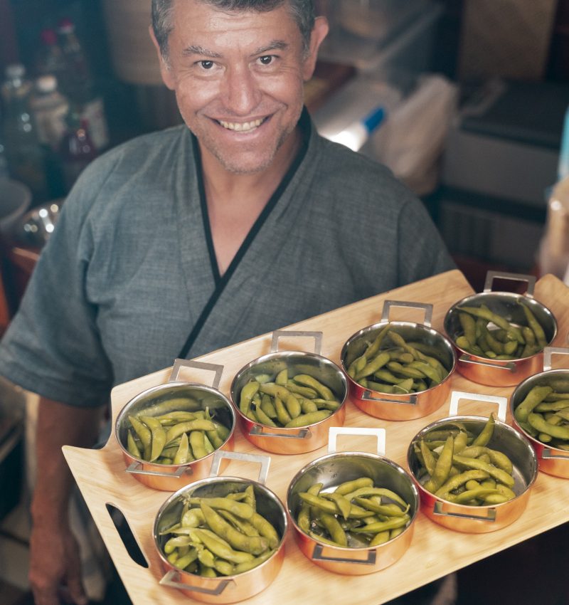 Chef presenting gourmet dishes during a sailing experience