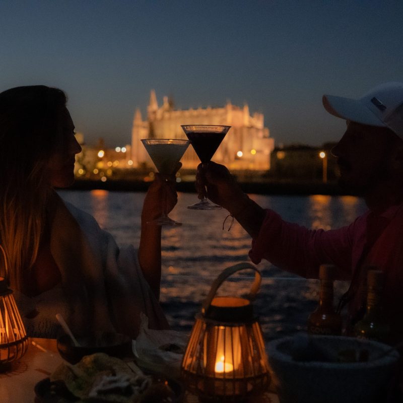 Sunset toast on deck during a private boat tour Mallorca