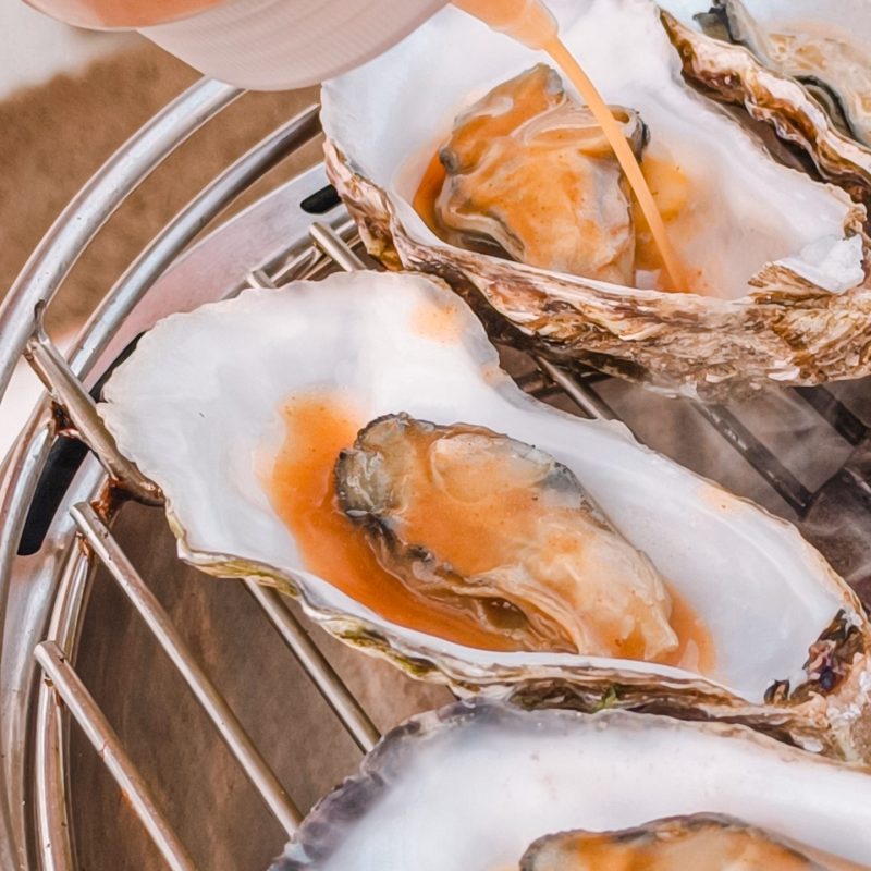 Fresh oysters served at sea during a private boat tour Mallorca